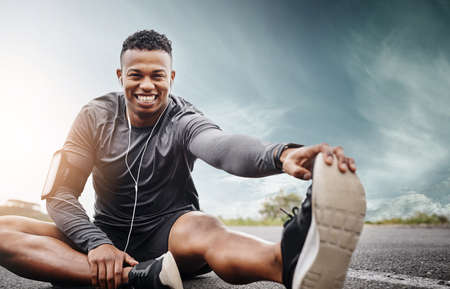 Im getting better at this. Portrait of a sporty young man exercising outdoors.