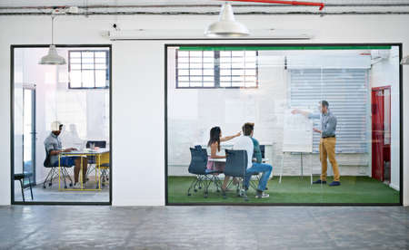 Theyre all ears. Shot of a business meeting on the go.