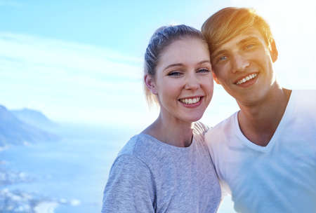 We love hiking. Cropped portrait of a young couple on a hike.の写真素材