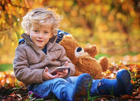 Im allowed anywhere, as long as I have my phone. Cropped portrait of an adorable little boy using...
