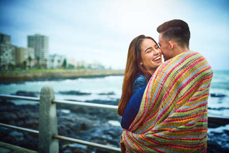 Who said you need a bed to cuddle. Shot of a happy young couple spending a romantic day together...