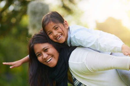 Its always bliss when were together. Portrait of a mother and daughter enjoying the day outdoors...