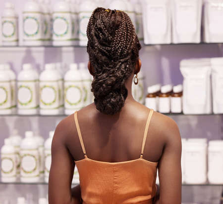 To know a woman is to go shopping with her. Shot of a unrecognizable female standing in a shop.の写真素材