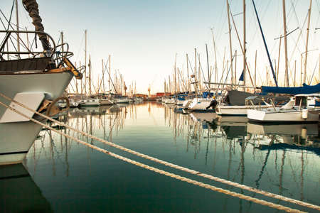 Safe harbour in a stormy world. A photo of a harbor with anchored ships..