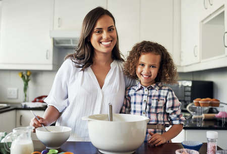 To what do I owe this gift my love. Portrait of an adorable little girl baking with her mom at home.