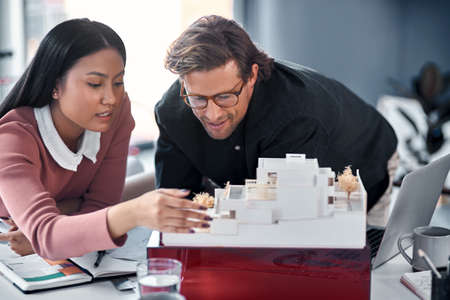 Attention to detail is crucial in this industry. Shot of two young architects working together on a...