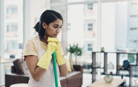 Sometimes the sparkle isnt there no matter what I do. Shot of a young woman looking unhappy while...