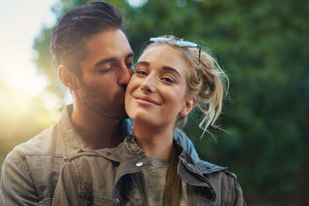 I love being his. Shot of a young couple out in the city.の写真素材