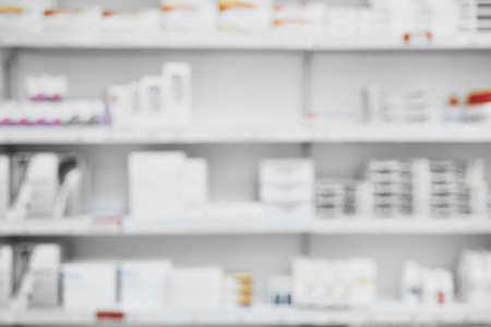 What a selection. Shot of a shelf full of medication and medication boxes all neatly placed next to each other in a pharmacy.の写真素材