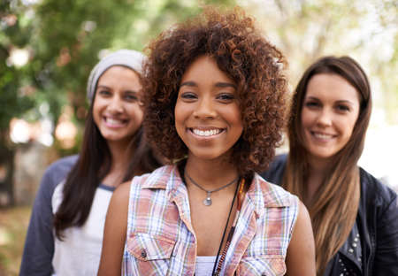 Chilling with the girls. A group of friends chilling outdoors during the summer.の写真素材