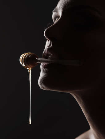 One important key to success is self-confidence. Studio shot of a woman woman posing against a black background.の写真素材
