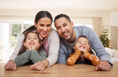 The picture of a beautiful family. Shot of a young family spending time together at home.の写真素材