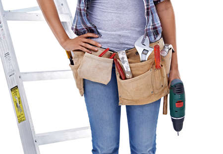 No job is too small.... Cropped shot of the midsection of a female construction worker.の写真素材