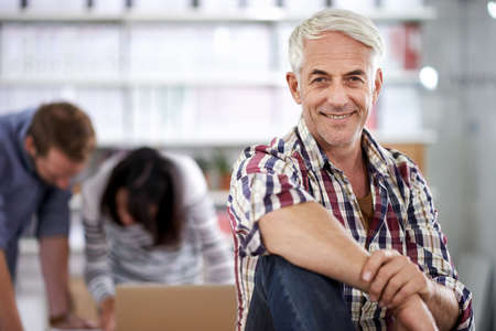 Top dog of the design world. Portrait of a confident mature businessman in a laid-back office...