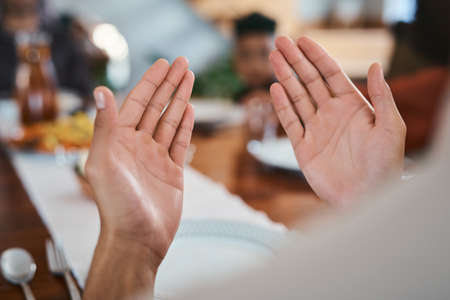 Let prayer lead the way. Shot of a muslim person praying before breaking their fast.