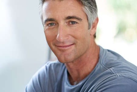 He exudes quiet confidence. Cropped shot of a handsome mature man relaxing at home.