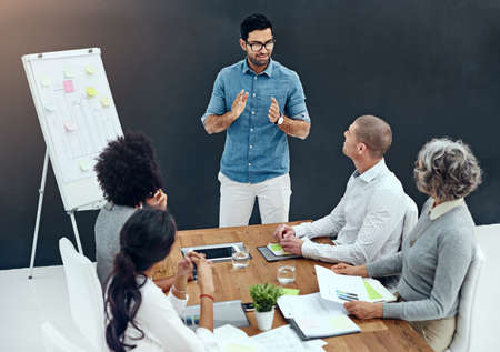 Ive got a strategy to succeed. Shot of a businessman giving a presentation in the boardroom.の写真素材