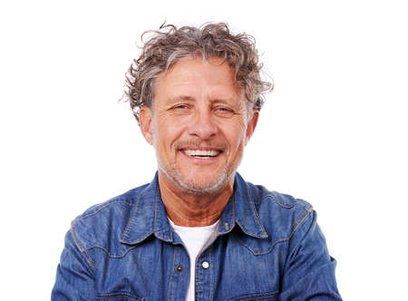 Feeling relaxed and taking it easy. Studio portrait of a happy mature man wearing a denim shirt...