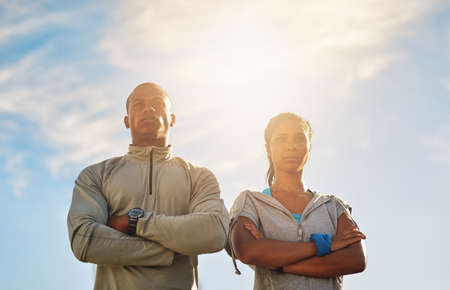 The best project youll ever work on is you. Shot of a young sporty couple out for a workout.の写真素材