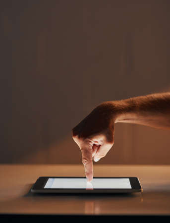 Everything is right at your fingertips. Cropped shot of an unrecognizable person using a digital...