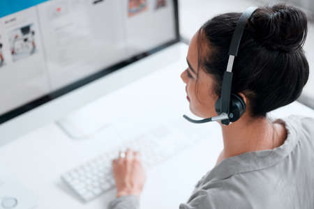 We can upgrade your package. Shot of a young female call center worker.
