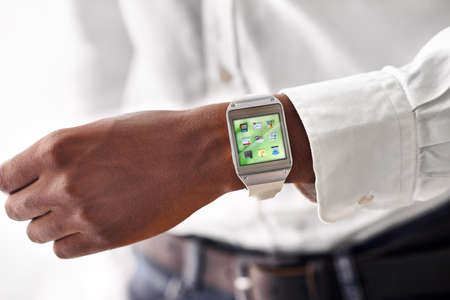 Taking technology on the go. Cropped view of a man wearing a smartwatch - All screen content is...