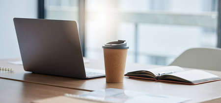 Setting up for a busy day ahead. Shot of a neatly arranged work station in a modern office.