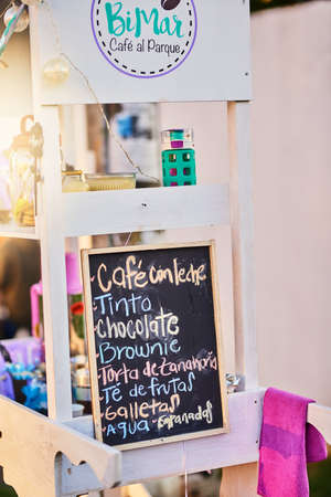 Such a great variety to choose from. Shot of a baked goods stall with a variety of goods to choose from and written down on a chalk board.の写真素材