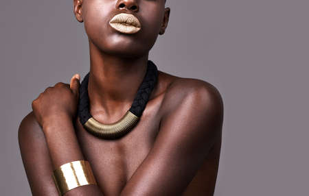 All she needed to wear was her jewellery. Cropped studio shot of a beautiful semi-dressed woman wearing jewelry.の写真素材