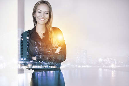 Success in the city. Multiple exposure portrait of a beautiful woman superimposed over a city.の写真素材