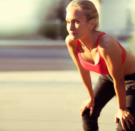 These morning runs kick start my day the right way. An attractive young runner stand alongside a...