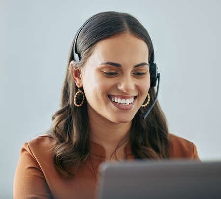Its not a problem at all. Shot of an attractive young saleswoman sitting alone in her office and...