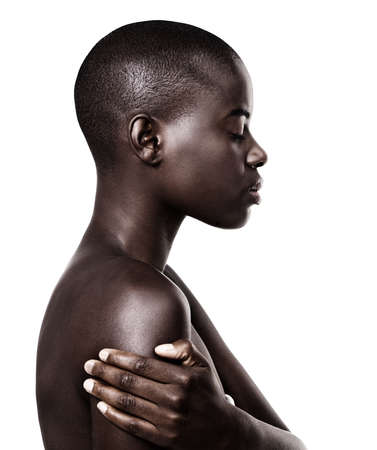 Jamaican me crazy. Profile shot of a beautiful young african woman isolated on white.の写真素材