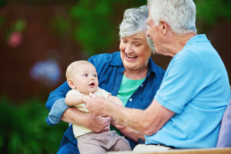 Be the grandparent you want them to remember. Cropped shot of a senior couple spending time with their grandson.の写真素材