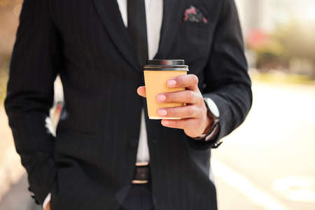 Get your engines started. Shot of a businessman enjoying a cup of coffee.の写真素材