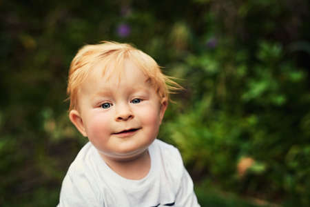 Im a boy for the playground. Shot of an adorable little boy playing in the backyard.