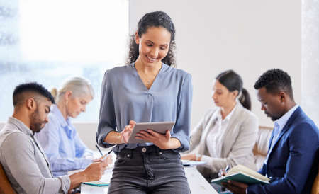 Many ideas grow better. Shot of a confident young businesswoman working in a modern office.