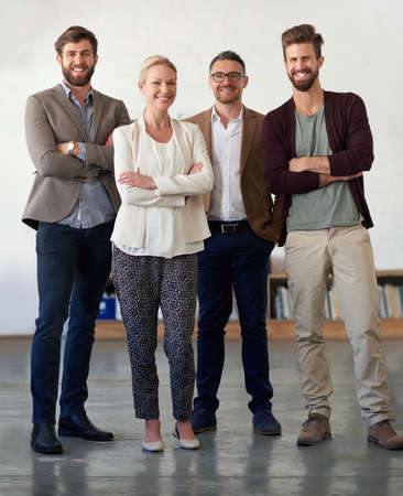 Dynamic team of diverse perspectives. Group of contemporary creative professionals in an open office...