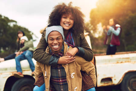 Youre only young once. Portrait of a happy young couple enjoying the winter weather outside.の写真素材