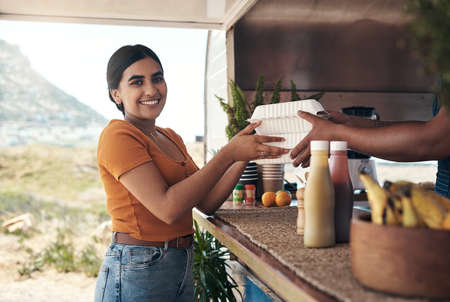 Ive been thinking about this all week. Shot of a customer receiving their food order.
