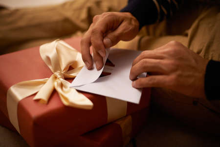 Spreading the joy. Shot of a handsome young man getting ready for Christmas.