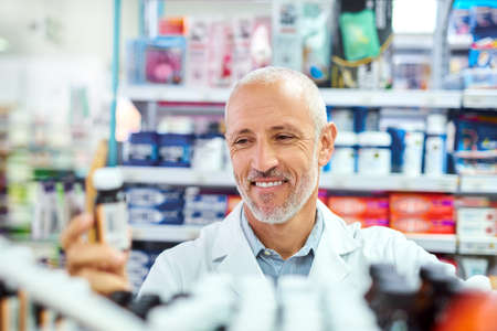 Youll always find what you need at our pharmacy. Shot of a mature pharmacist working in a chemist.の写真素材