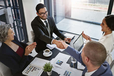 I look forward to working you. Shot of businesspeople in an office.の写真素材