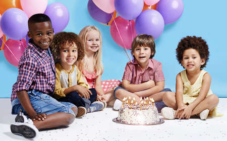 My birthday wish is to be friends forever. Shot of a group of children sitting around a birthday...