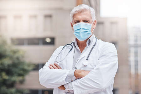 Hes dedicated to providing the best kind of healthcare. Shot of a mature male doctor standing with...