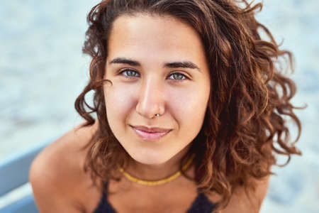 Beauty on the beach. Cropped shot of a beautiful young woman outside.