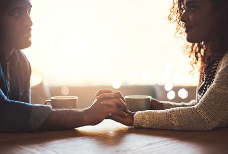 Its the little things that matter. Shot of a young couple spending time together at a cafe.の写真素材