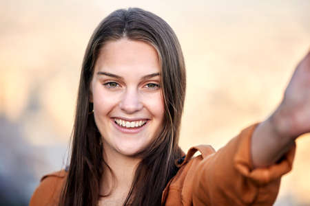 Stay happy and healthy. Closeup shot of a beautiful young woman spending time outdoors.の写真素材