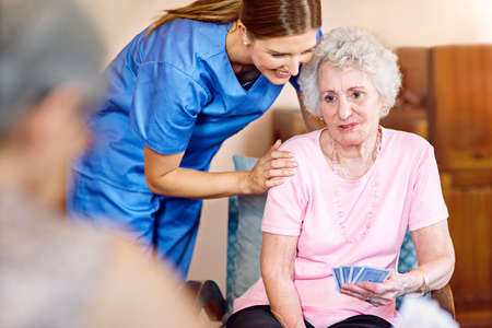 Youve got this. Cropped shot of seniors playing cards in their retirement home.