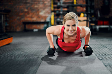 Im in the best shape of my life. Full length portrait of an attractive young female athlete working...